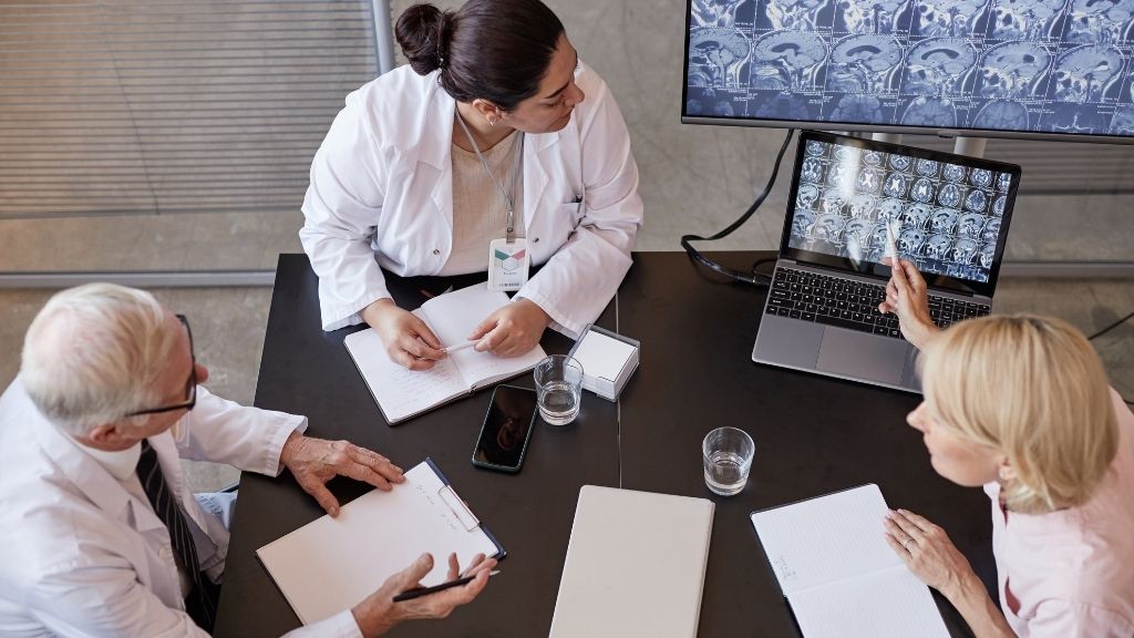 Multidisciplinary medical team reviewing cancer treatment options in Barcelona